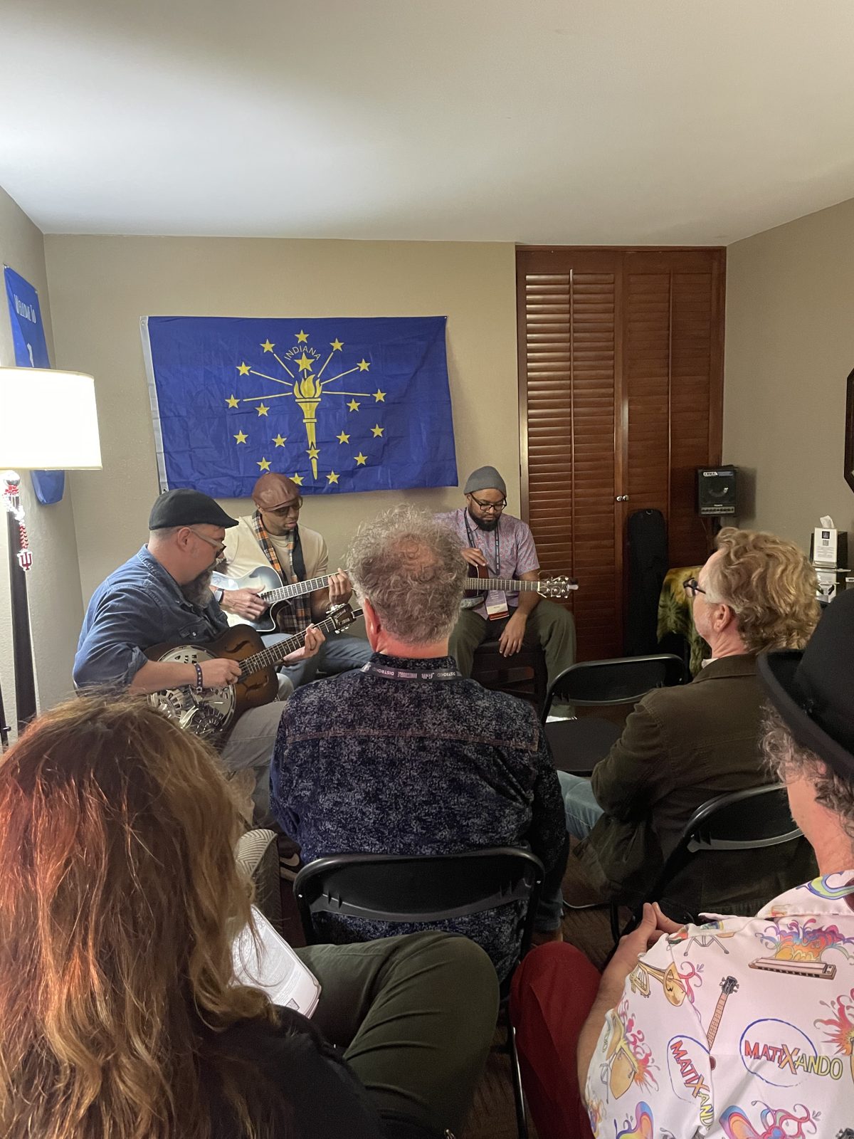 An audience listening to performers in the HooMac room at Folk Alliance International 2026