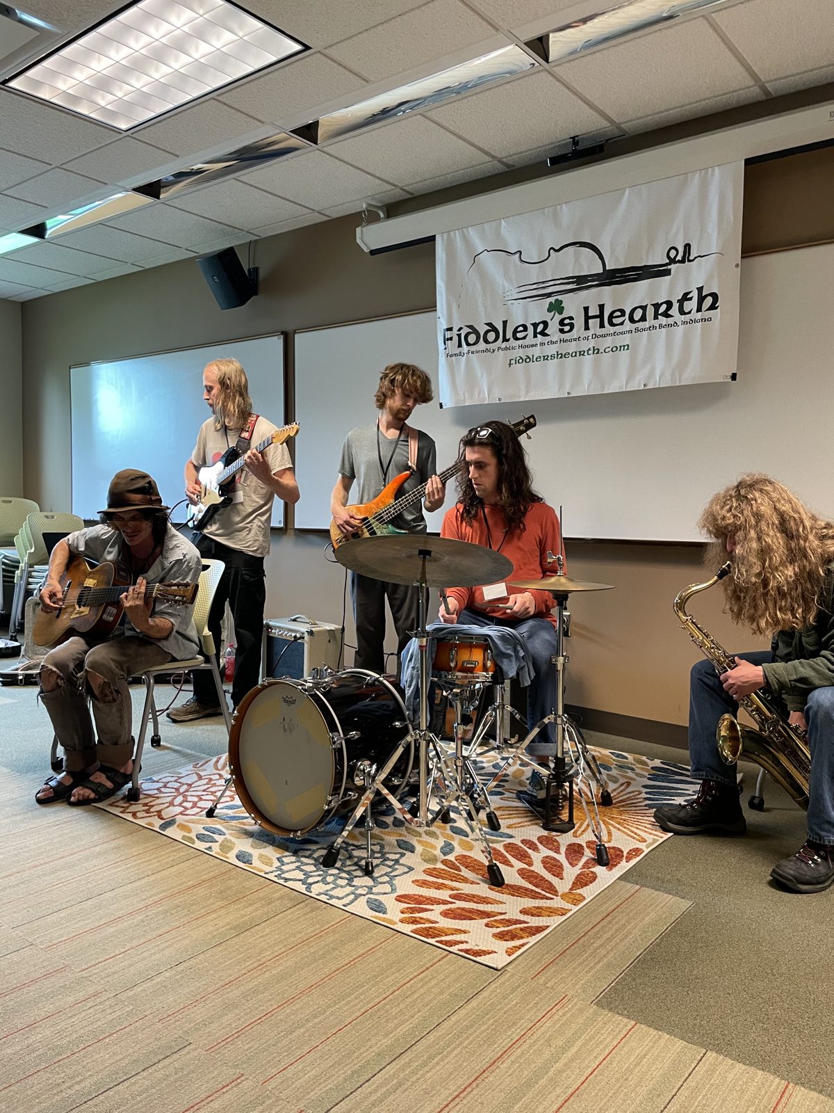 A band performing in the Fiddler's Hearth private showcase room