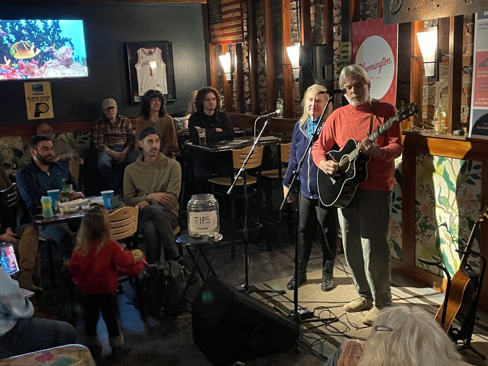 A duo performing to a full room at Sleeper's in Bloomington